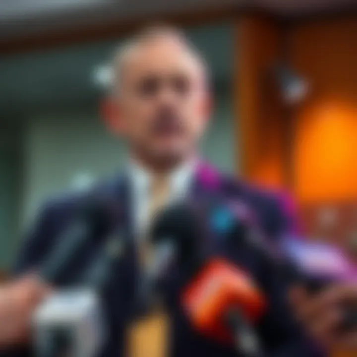 Sam Bankman-Fried's father speaking to the media A man in a suit is addressing reporters, with microphones in front of him, discussing his son Sam Bankman-Fried's legal situation.