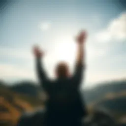 A person raising their hands in the air, standing on a hilltop against a bright sky, symbolizing freedom and liberty in modern society.